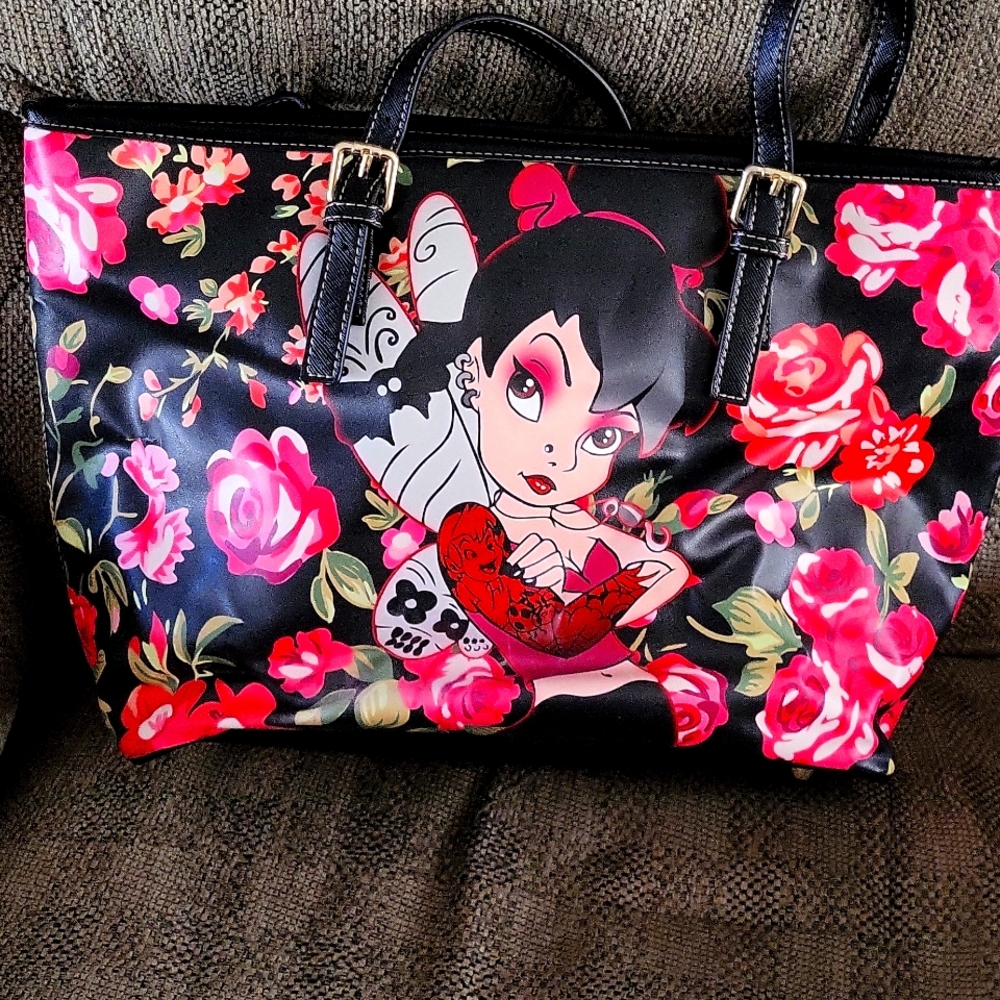 Lounge fly handbag with picture of bad tinker be on the front.